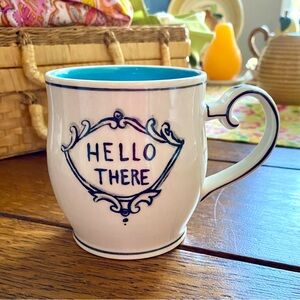 Anthropologie Molly Hatch “Hello There” mug. White W/Black Writing,Aqua Stripes